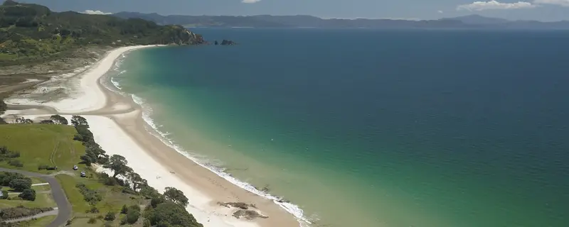 Aerial view of Otama Beach on the Coromandel, white sand curving to the headland