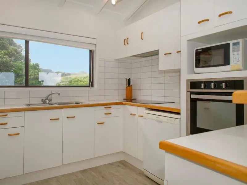 Kitchen with wall oven, microwave and dishwasher
