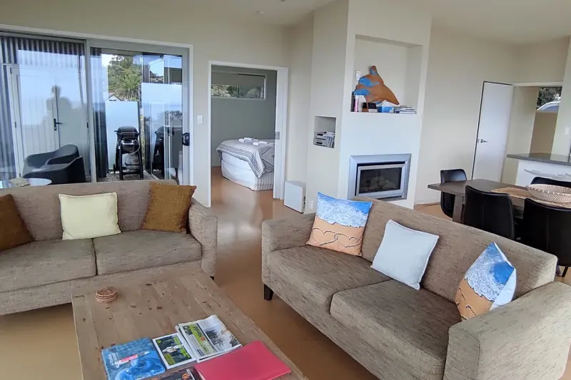 Upstairs lounge with sofas and a gas fireplace